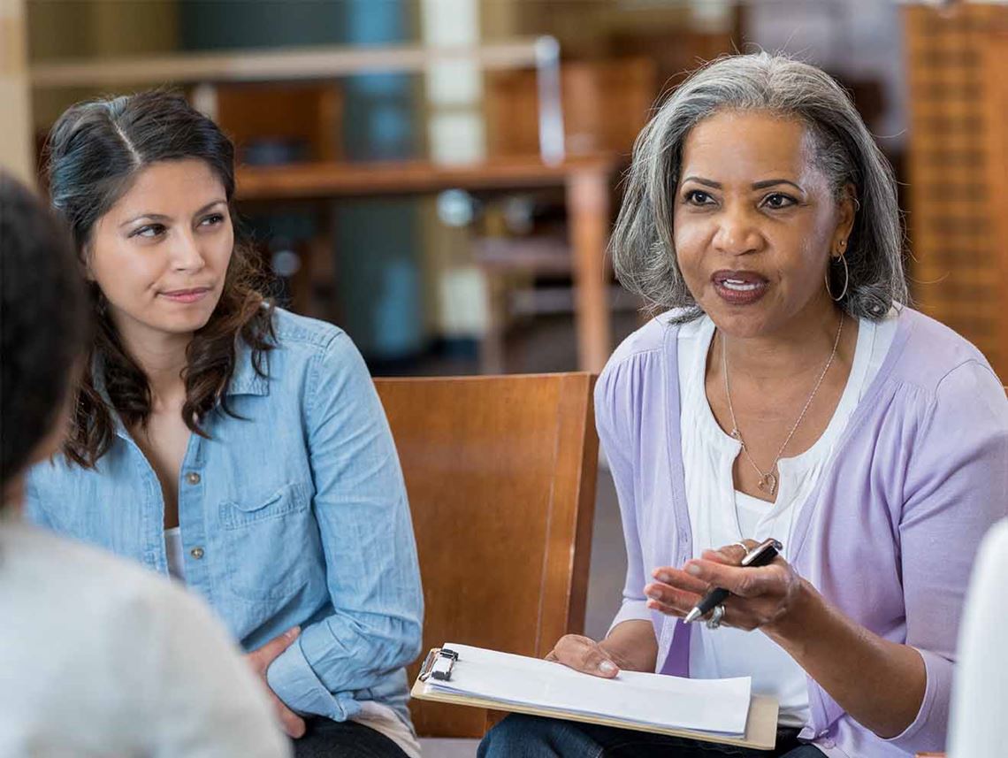 Woman leading a support group session