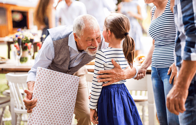 family celebrating at outdoor party