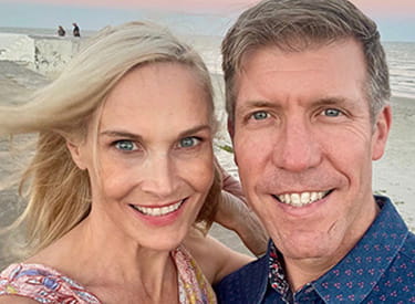 A selfie of stroke survivor, Laura Sammons, and her husband at the beach
