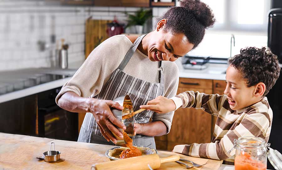 mom and young son making thanksgiving dinner
