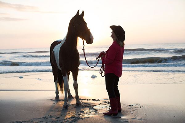 Debby and her horse at sunset - beach ride Debby and her horse at sunset - beach ride