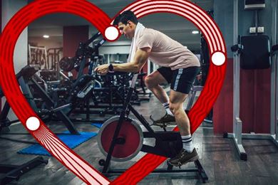 man riding an exercise bike