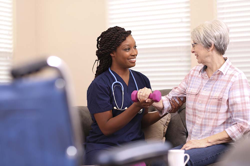 Woman undergoing rehab with therapist