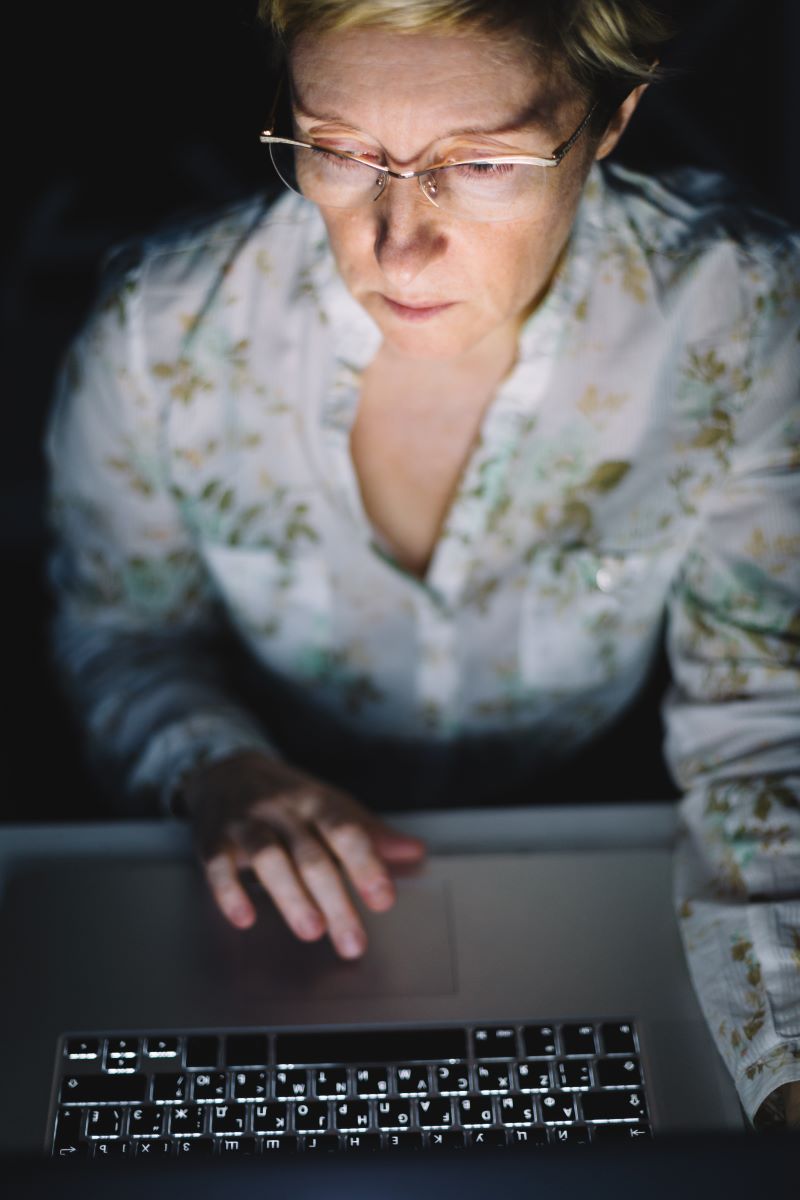 Middle Aged Woman Working on a Laptop