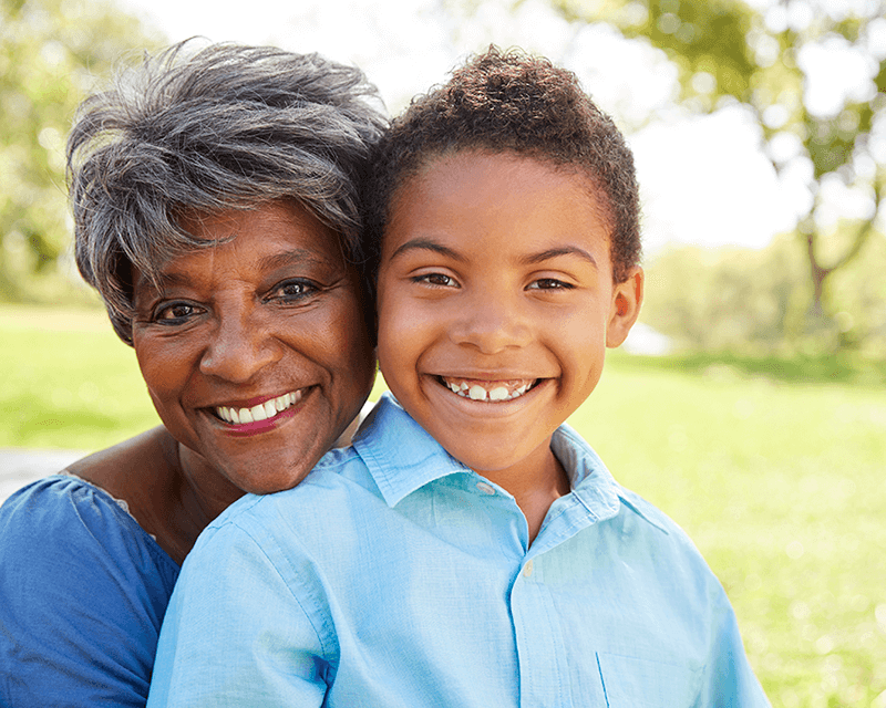 grandmother with grandson relaxing in the park