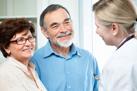 senior couple talking to doctor senior couple talking to doctor