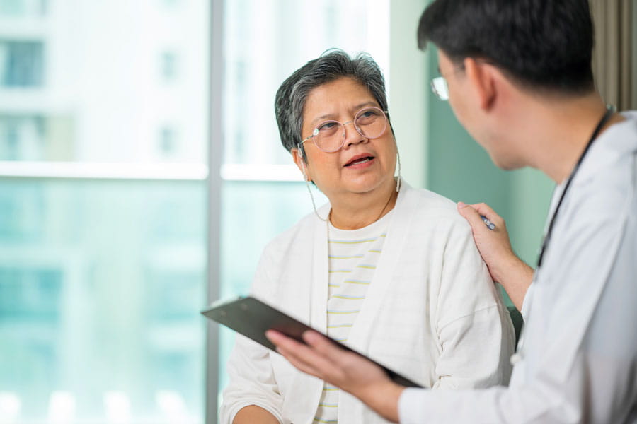 Older women listening to her doctor
