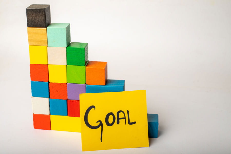 Colorful blocks next to the word Goal