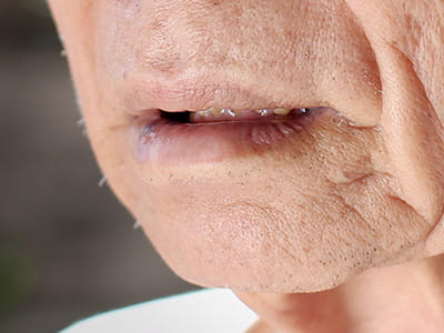 Close-up of an older person's mouth