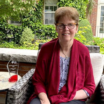 Kathleen O’Leary is sitting on a porch next to her Voters’ Choice Stroke Hero Award trophy. Kathleen O’Leary is sitting on a porch next to her Voters’ Choice Stroke Hero Award trophy.