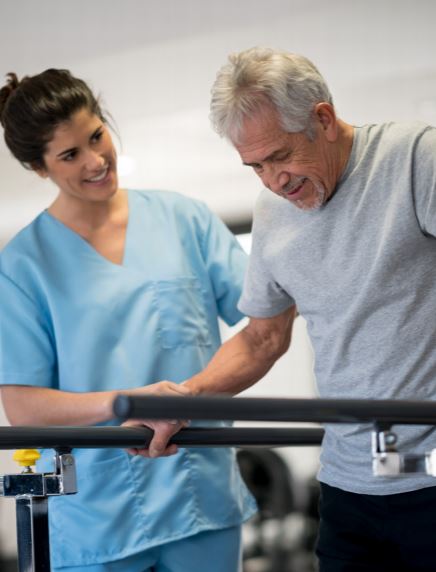 Therapist assisting patient with rehabilitation