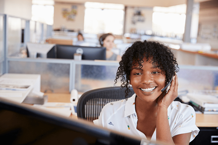 woman working in a call centre answering phone woman working in a call centre answering phone