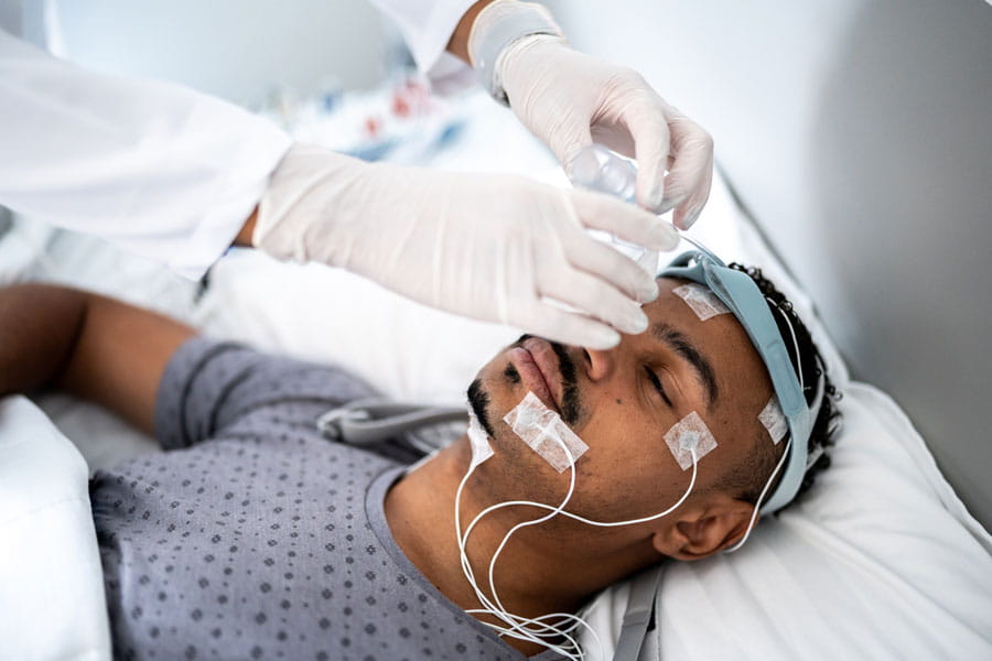 Man being prepped for a sleep study